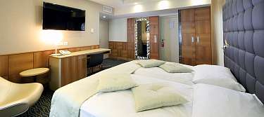 Senior Suite sleeping area with king-size bed